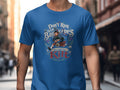 Blue t-shirt with a graphic of a bagpiper and the text "Don't Run With Bagpipes You Could Get Kilt".