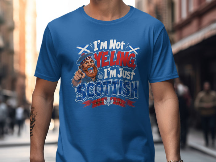 Blue t-shirt with cartoon Scottish man and text "I'm Not Yelling, I'm Just Scottish."