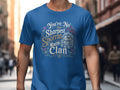 Blue t-shirt with "You're No' the Sharpest Sporran in the Clan" text and Scottish imagery.